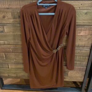 Rust color w/ built in belt. Midi length.